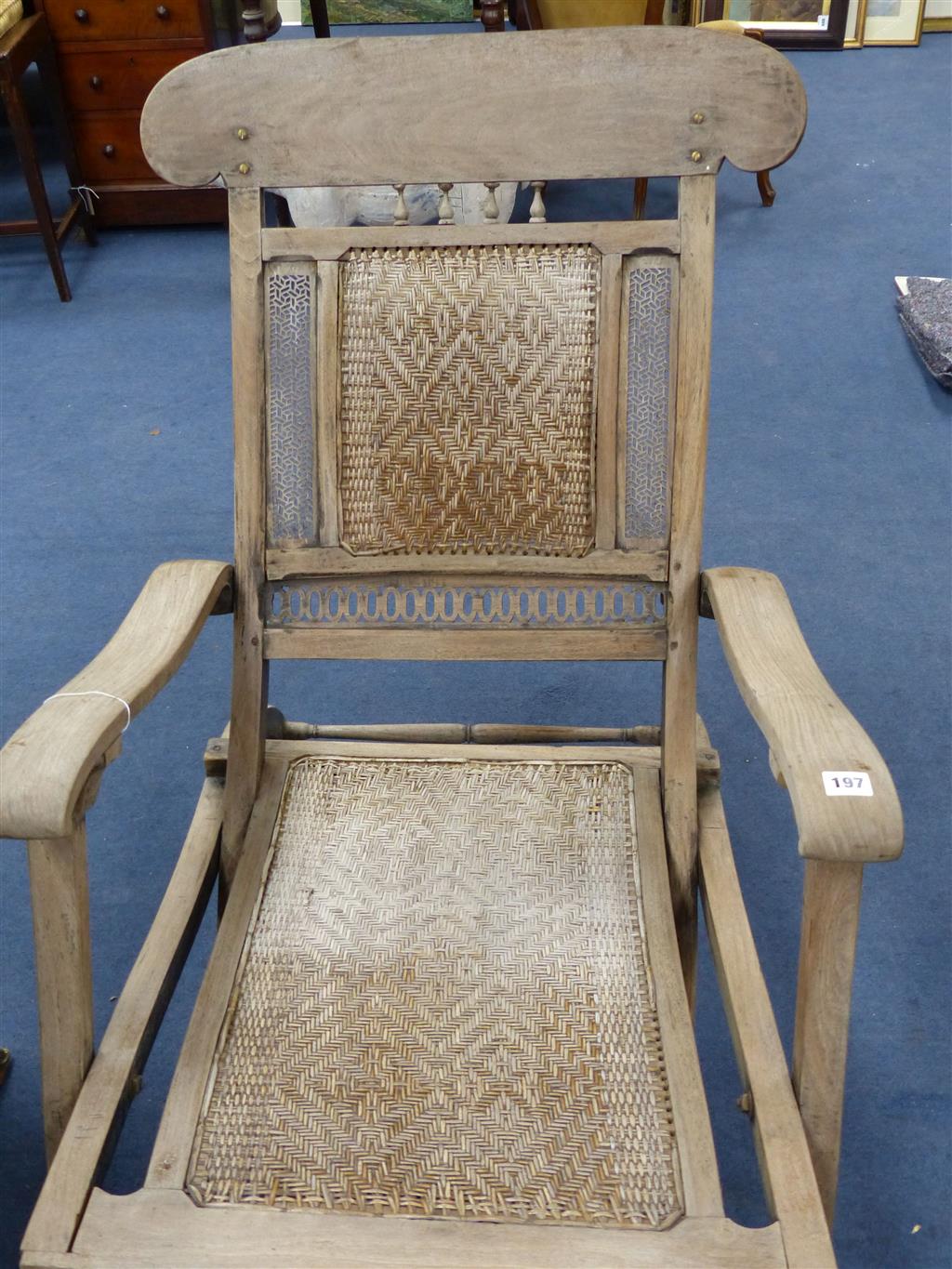 An Anglo Indian caned bleached hardwood steamer chair